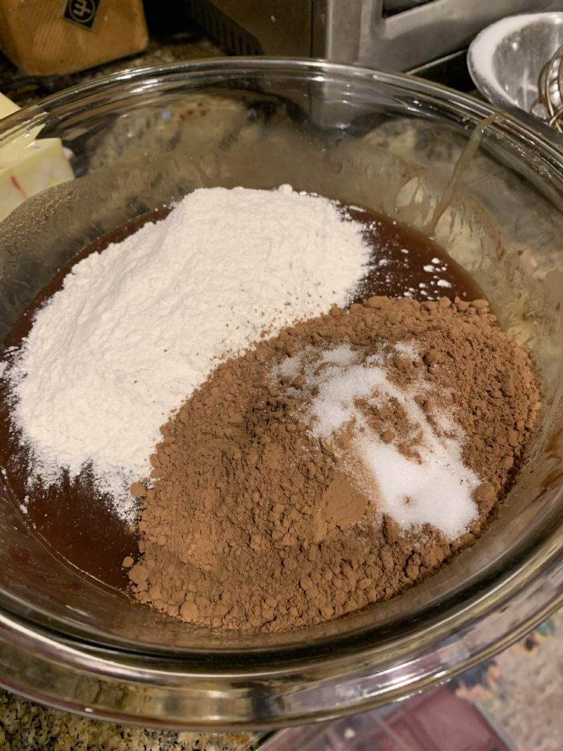 Add flour, cocoa, and salt. Use a wooden spoon to combine.